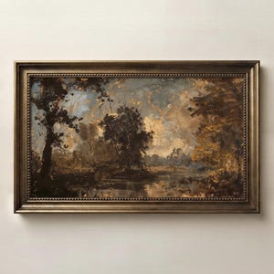 May include: A rectangular landscape painting in a dark bronze-toned frame. The artwork depicts a scene with dark trees, a calm body of water, and a cloudy sky in shades of brown, gold, and muted blue, rendered with visible, textured brushstrokes.