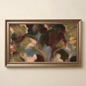 May include: A rectangular framed painting featuring an abstract composition with blended strokes of deep burgundy, sage green, soft blue, and cream. The artwork is enclosed in a metallic gold frame with a beaded texture along the inner edge.