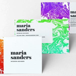 May include: Three business cards with a colorful abstract design. The text on the cards reads "maria sanders, interior designer" with contact information.
