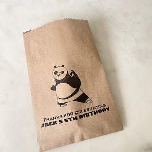 May include: Brown paper bag with a black and white panda bear illustration. The bag has the text "Thanks for celebrating Jack's 5th Birthday" printed on it.