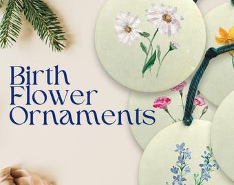 Peut inclure: Ornements ronds avec des motifs floraux à l'aquarelle, dont des marguerites, des jonquilles, des œillets, des delphiniums et des soucis. Chaque ornement a une ficelle vert foncé pour l'accrocher. Le texte "Birth Flower Ornaments" est affiché en bleu.