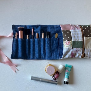 May include: A trio of ceramic mugs with a speckled, matte finish in cream, light grey, and dark grey. The mugs have a simple, minimalist design, suitable for coffee or tea.