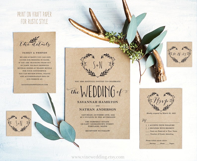 May include: Rustic wedding invitation suite with kraft paper cardstock. The invitation features a wreath with a heart and the text "the wedding of Savannah Hamilton and Nathan Anderson". The RSVP card has a wreath with a heart and the text "RSVP".
