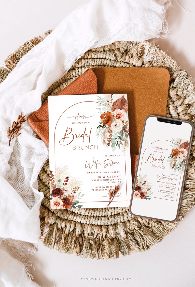 May include: A white invitation card with a brown arch and floral design. The text on the card reads "Please join us for a Bridal Brunch in honor of Willow Soffion. March 28th, 20XX | 3:00 PM. Fig & Garden, 89000 S. Kennedy Lane, Austin, TX. RSVP by March to Rachel 001880. Target"