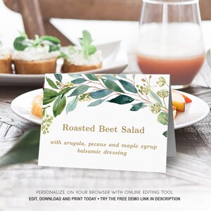 May include: A printable food label with a watercolor background of green leaves and flowers. The text reads "Roasted Beet Salad with arugula, pecans and maple syrup balsamic dressing".