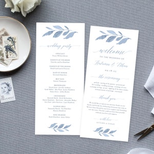 May include: Wedding ceremony program with a watercolor blue leaf design. The program includes the officiant, parents of the bride and groom, maid of honor, best man, bridesmaids, groomsmen, flower girls, and ring bearers. The program also includes a welcome message and a thank you message from the couple.