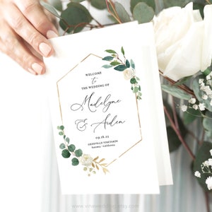 May include: Wedding welcome sign with a gold geometric frame and greenery. The text reads "Welcome to the wedding of Madeline & Aiden 09.18.23 Grenville Vineyards Sonoma, California".