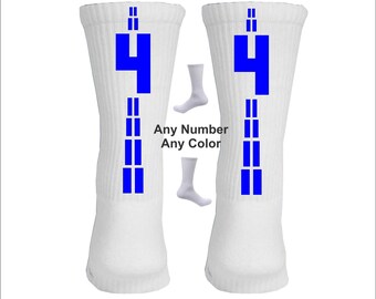 May include: Pair of white athletic socks with blue stripes and the number "4" printed on each sock. "Any Number Any Color" is printed below the socks.