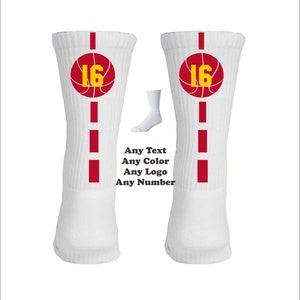 May include: Pair of white basketball socks with red and yellow accents. The socks feature a basketball with the number 16 on it. Any Text, Any Color, Any Logo, Any Number.
