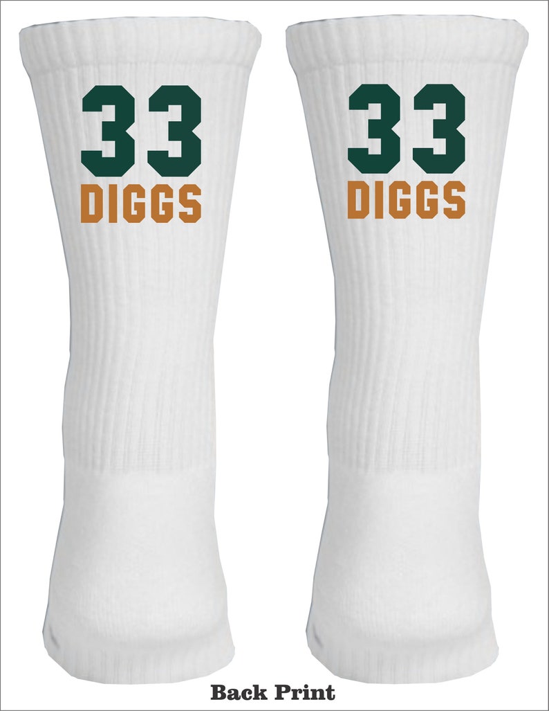 May include: White athletic socks with a green number 33 and the name "DIGGS" in orange lettering.