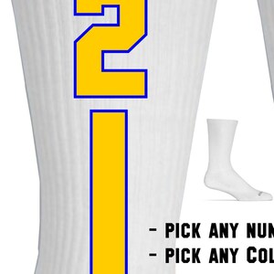 May include: White athletic socks with a yellow number "2" outlined in blue.  Pick any number and color.