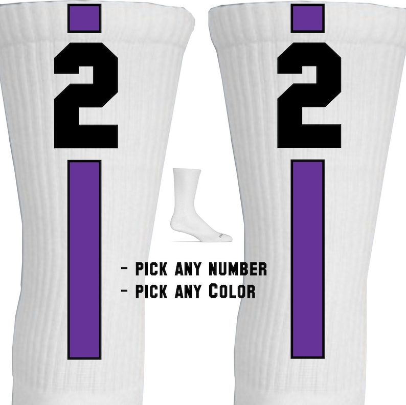 May include: Pair of white athletic socks with a purple stripe and a black number "2" on each sock.  "Pick any number" and "Pick any color" are written below the socks.