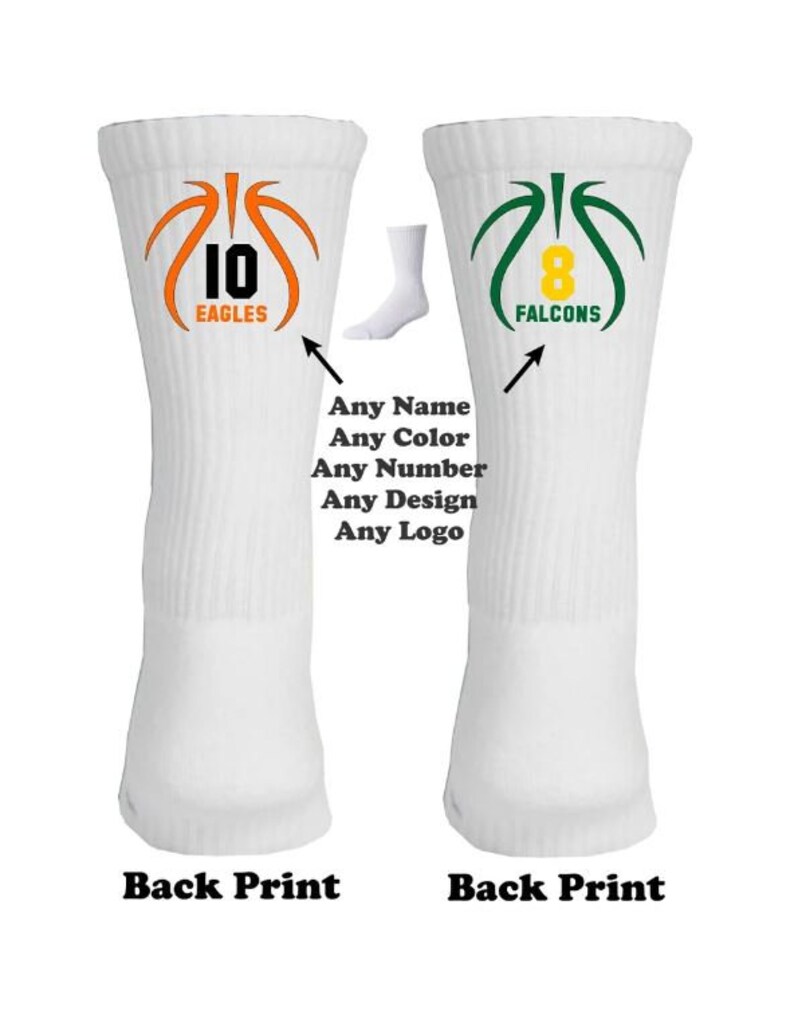 May include: Two white basketball socks with custom designs. The left sock has an orange basketball with the number 10 and the word "EAGLES". The right sock has a green basketball with the number 8 and the word "FALCONS".