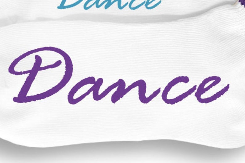 May include: White socks with the word "Dance" written in purple cursive lettering.