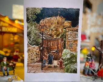 May include: A watercolor painting of a snowy street scene in Edinburgh, Scotland. The painting depicts Edinburgh Castle in the background, with a family walking down the street in the foreground. The painting is titled "Christmas in Edinburgh".