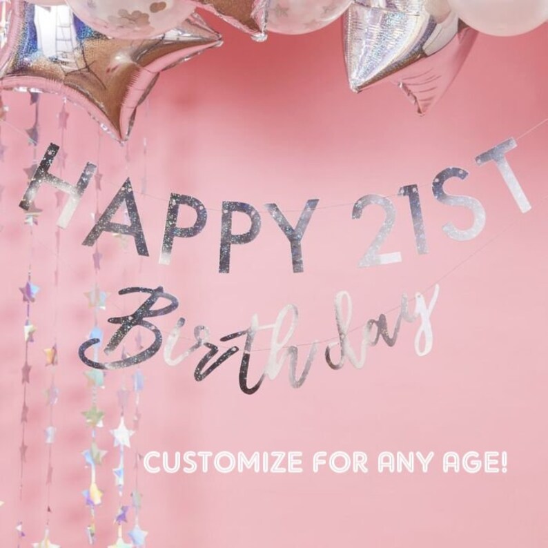 May include: Silver glitter Happy 21st Birthday banner with a pink background. The banner is strung with silver stars. The text "Customize for any age!" is printed below the banner.