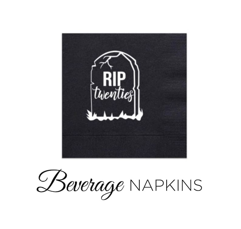 May include: Black beverage napkins featuring a white tombstone design with the text "RIP twenties." The square napkins have a textured finish. The words "Beverage Napkins" are written in cursive below the napkins.