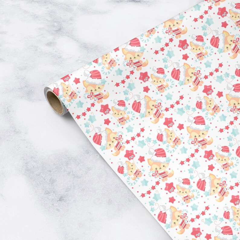 May include: White wrapping paper with a repeating pattern of a fox wearing a Santa hat and holding a gift. The fox is surrounded by red and blue stars and candy canes.