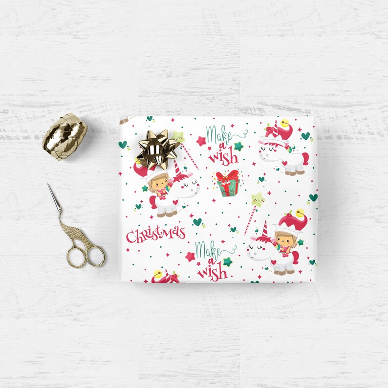 May include: White wrapping paper with a repeating pattern of a unicorn with a girl riding it, stars, hearts, and the text "Make a wish" and "Christmas".