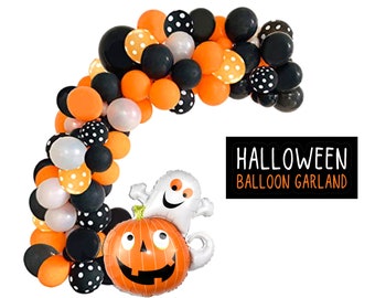 May include: A Halloween balloon garland featuring orange, black, white, and polka-dot balloons. A large foil balloon shaped like a smiling jack-o'-lantern with a ghost on top is included. Text on the right reads HALLOWEEN BALLOON GARLAND.
