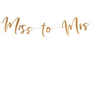 May include: Gold glitter banner with the text "Miss to Mrs" hanging on a string.