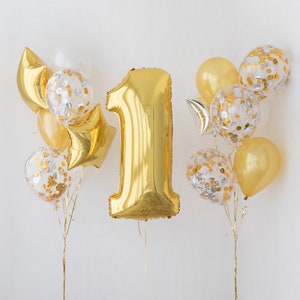 May include: Gold number one balloon with gold and silver confetti balloons.