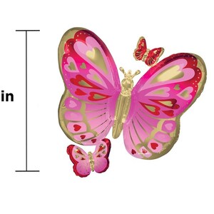 May include: A large pink and gold foil butterfly balloon with smaller pink and gold foil butterfly balloons. The large balloon is 29 inches tall.