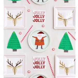 May include: A festive arrangement of Christmas-themed party supplies. Includes square plates with reindeer and Santa Claus designs, green tree cutouts, red and white striped straws, and the text "JOLLY JOLLY JOLLY". Peppermint candies are scattered throughout.