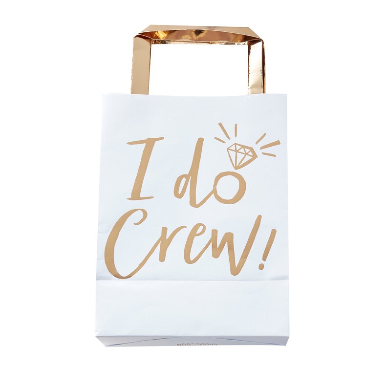 May include: White paper gift bag with gold handles and the text "I do Crew!" printed on the front. A gold diamond ring icon is above the text.