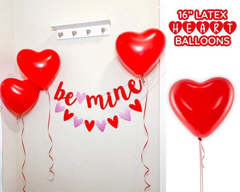 May include: Red heart-shaped latex balloons with a banner that reads "be mine" in red letters with pink glitter hearts. The balloons are 16 inches in diameter.