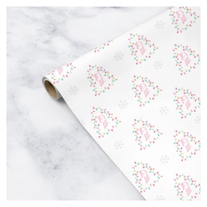 May include: White wrapping paper with a repeating pattern of Christmas trees decorated with colorful lights. The trees have the text "It's Lit" written on them.