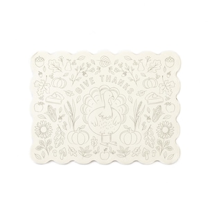 May include: Off-white rectangular placemat with a scalloped edge. The placemat features a line drawing of a turkey, pumpkins, leaves, and the words "GIVE THANKS". The design is in a neutral color, suitable for Thanksgiving.