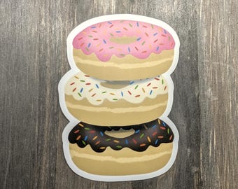 Pegatina de pila de donuts glaseados: glaseado de chocolate, fresa y vainilla.