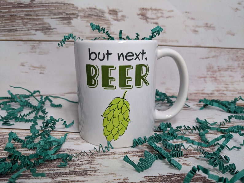 But Next, Beer 11 oz ceramic mug with hop illustration