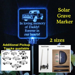 May include: A blue solar-powered grave marker with a white truck silhouette and the text "In loving memory of Daddy! Forever in our hearts!"  The marker is on a metal stake and there are nine additional truck designs to choose from.  The marker is available in two sizes: small and large.