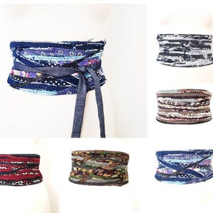 May include: A collection of six colorful fabric belts with different patterns and designs. The belts are made from recycled materials and are perfect for adding a unique touch to any outfit.