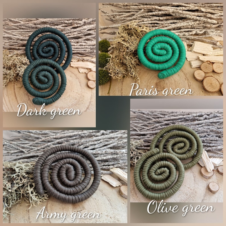 May include: A collection of four spiral-shaped decorative ornaments wrapped in fabric, labeled as Dark green, Paris green, Army green, and Olive green. Each spiral is constructed from a continuous coiled cord, showcasing distinct shades of green and brown.