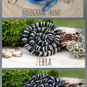 Three different styles of coiled fabric rope, each with a unique pattern. The first is a holographic shiny fabric, the second is a black and white zebra pattern, and the third is a black and white artistic pattern.