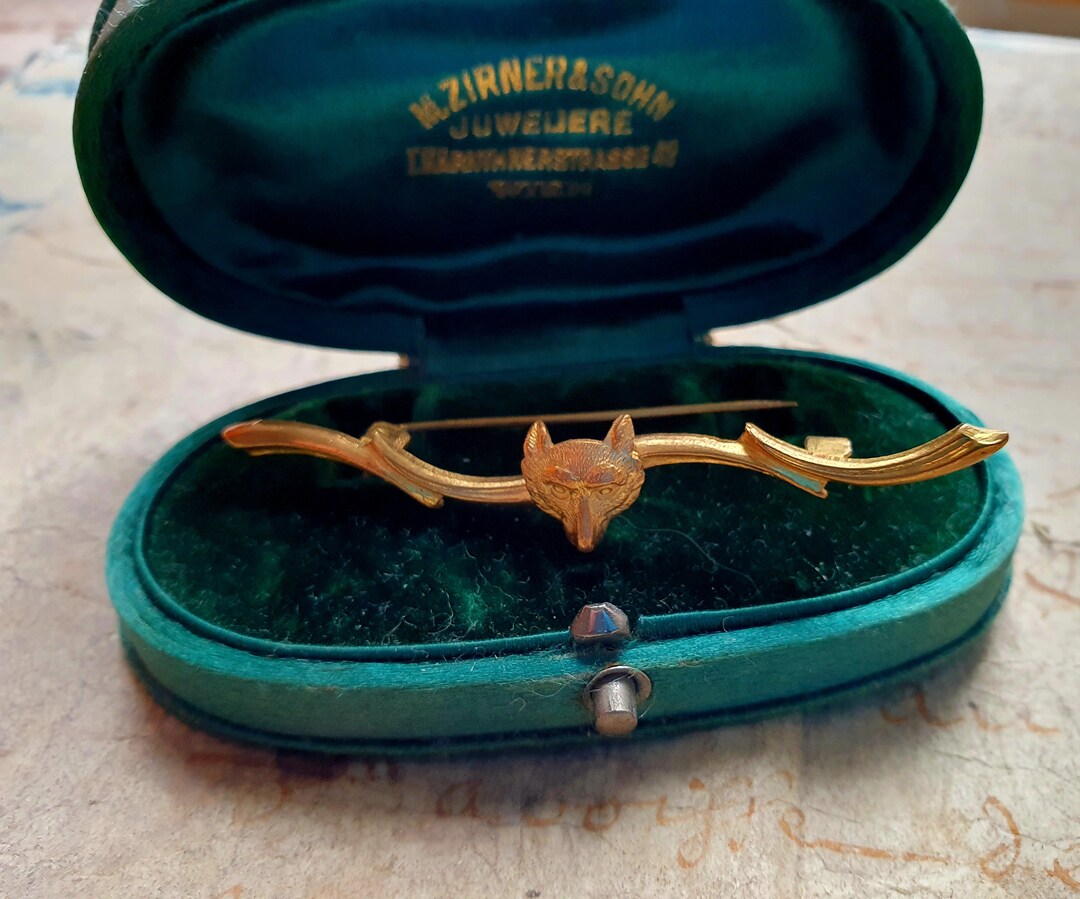 Grande broche vintage avec noeud doré et strass - France
