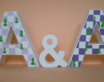 Thematic wedding decoration - letters of the couple as table decoration