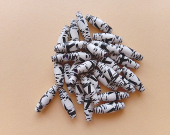 Various sets of handmade, sturdy paper beads in black and white