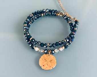 Double bracelet with blue hematite beads and gold-plated sand dollar medallion, women's bracelet with natural stone curb chain and Heishi