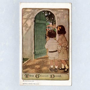 May include: A vintage postcard titled The Green Door featuring an illustration of two children standing before an open green wooden door. The children are dressed in light-colored clothing, and the scene includes a stone path and foliage.