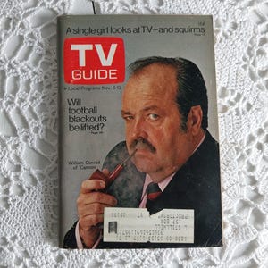 May include: A vintage TV Guide magazine cover featuring William Conrad, star of the TV show "Cannon", with the headline "Will football blackouts be lifted?" The cover is dated November 6-12.