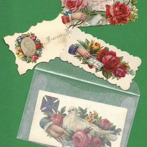 May include: Three vintage Valentine's Day cards with floral designs and lace trim. The cards feature roses, a dove, and the text "Have thoughts kindly of me." and "Truly thine".