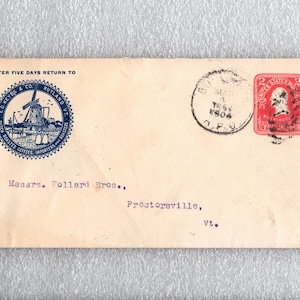 May include: A vintage envelope with a blue circular stamp featuring a windmill and the text "E.D. Meyers & Co. Rutland, Vt. Dutch Roasted Coffees, Importers & Roasters". The envelope also has a red stamp with the text "United States Postage 2 Cents" and a black postmark with the text "TRS 1904 T.P.O.". The envelope is addressed to "Messrs. Pollard Bros., Proctorsville, Vt."