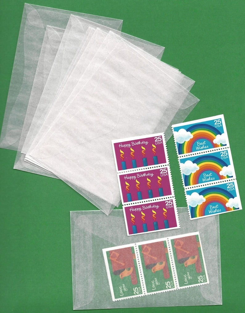 May include: A stack of clear plastic envelopes with a variety of colorful stamps featuring birthday candles, rainbows, and the words "Happy Birthday" and "Best Wishes".