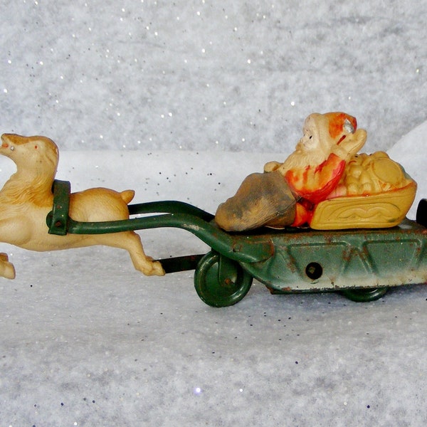 As Is Vintage Wind-Up Metal Toy, Santa Claus on Sled with Reindeer, Kewpie Doll in His Sack, Christmas Decoration, Blow Mold - 11904
