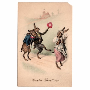 May include: Vintage Easter postcard featuring anthropomorphic rabbits. One rabbit holds a heart, another carries a cane, and a third holds flowers. The background shows a church and the words "Easter Greetings".