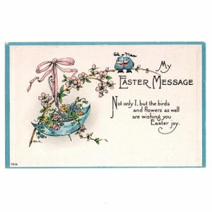 May include: Vintage Easter postcard with a light blue border. The illustration features a blue parasol filled with flowers, a pink bow, and two blue birds on a flowering branch. Text reads "My Easter Message" and a seasonal greeting.